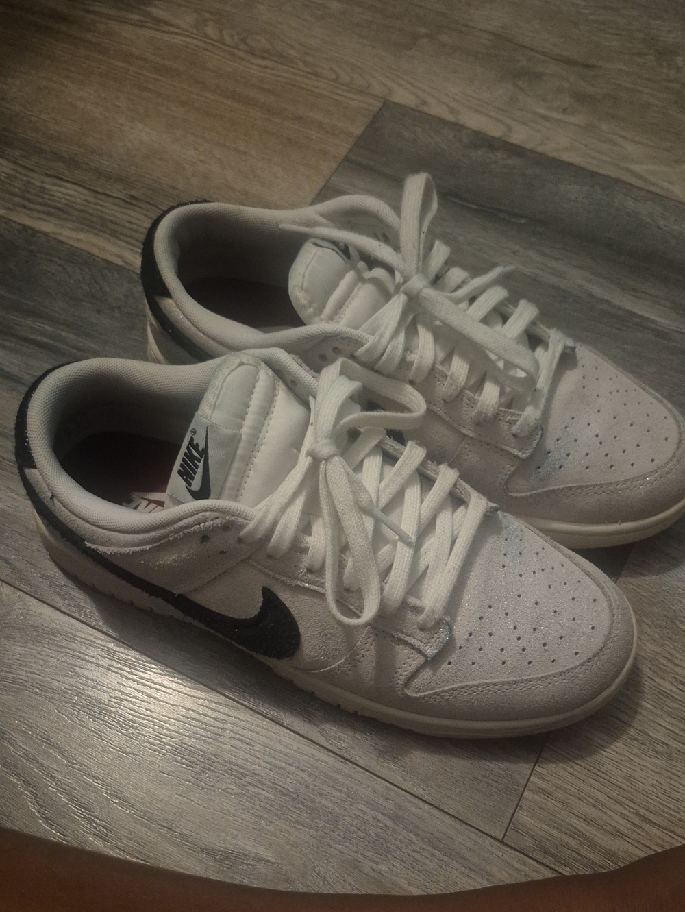 Nike White and Black Low-Top Sneakers with Black Swoosh